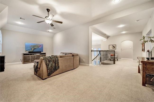 Spacious upstairs game room offers plenty of natural light—perfect for work, play, or relaxing with family. | Image 30