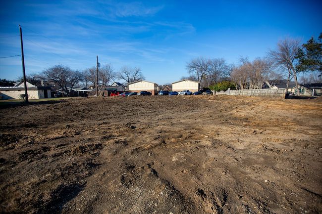 View of yard with a residential view and fence | Image 4