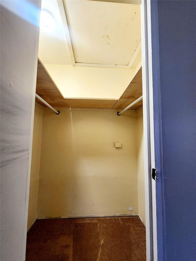 Large primary closet w/ attic storage | Image 9
