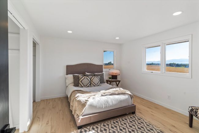 Bedroom with light hardwood / wood-style flooring | Image 24