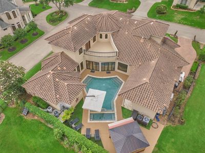 This 5300sf custom estate is on over 1/3 of an acre and offers ultimate privacy in the resort-style pool area. | Image 3