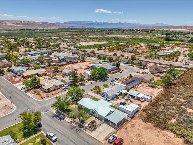 Aerial view of residential area featuring a mountain backdrop | Image 36