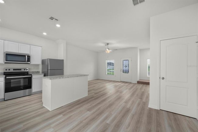 13458 Leaping Water Way, House other with 3 bedrooms, 3 bathrooms and null parking in ASTATULA FL | Image 4