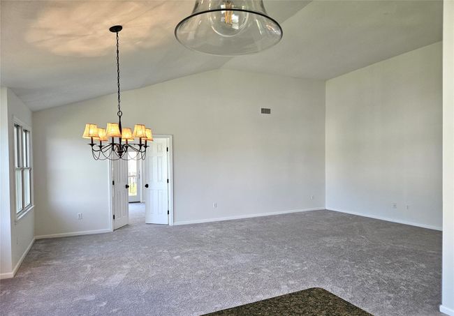 The Kitchen Opens Into The Spectacular Great Room Offering An Open 19'5" x 14'8" Dining Room & 17'2" x 11'3" Living Room With Stunning Soaring Ceilings, Lots Of Large Windows For Natural Light & Ample Room For Furniture. | Image 5