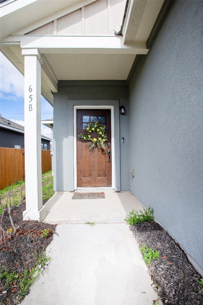 Entrance to property featuring fence and stucco siding | Image 8