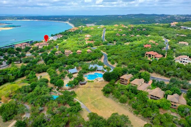 Bird's eye view of a nearby body of water and a pool | Image 33