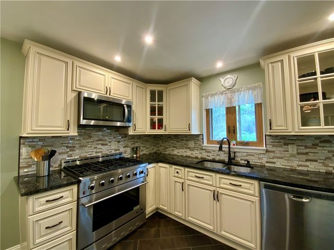 Updated kitchen with a 6 burner convection gas stove | Image 9