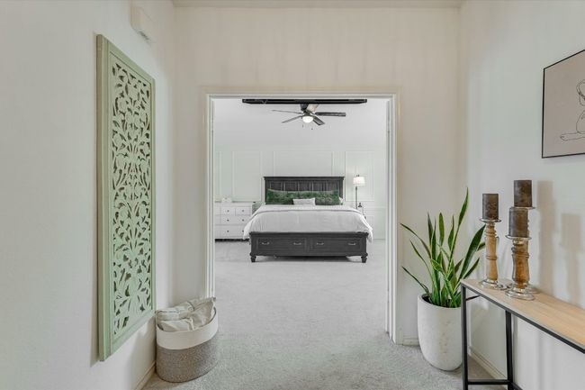 Carpeted bedroom with baseboards | Image 16