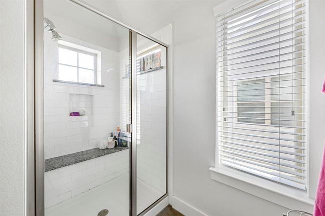Bathroom with a stall shower and baseboards | Image 21