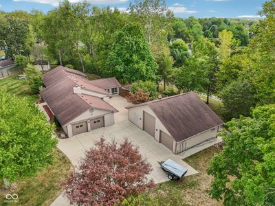 Detached garage over 1000 sq ft, built in 2012 w/ 100 amp service, utility sink w/ hot & cold water w/ bathroom. Building is completely insulated with insulation between the bays. | Image 3