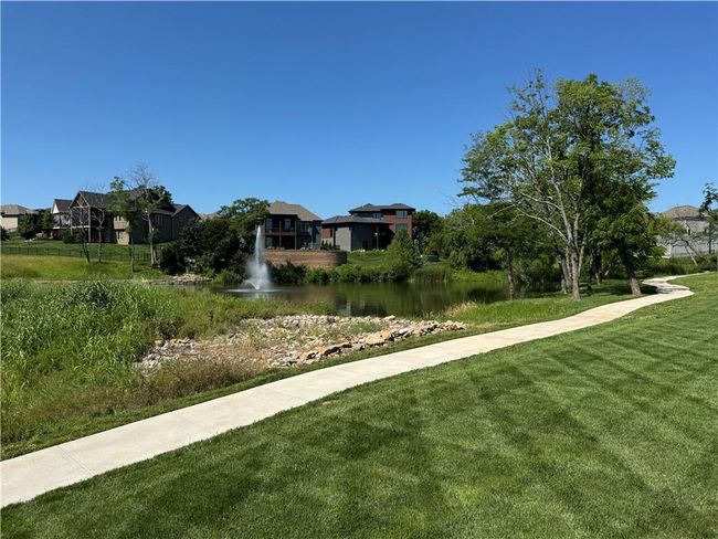 View of home's community featuring a yard, a water view, and a residential view | Image 67