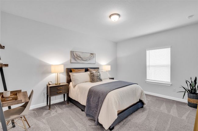 Bedroom featuring light colored carpet | Image 32
