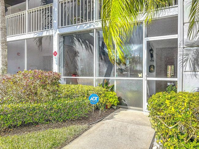Front lanai has full glass sliders and screened for year round use. Great place to enjoy morning coffee or afternoon happy hour. | Image 10