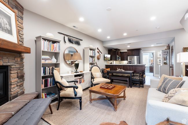 Living room with visible vents, recessed lighting, and a stone fireplace | Image 4