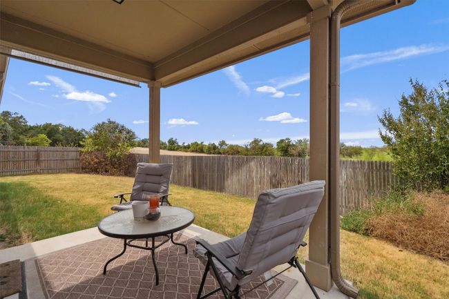 From your covered back patio, watch the 9 Hole Disc Golf Course in the park behind | Image 24