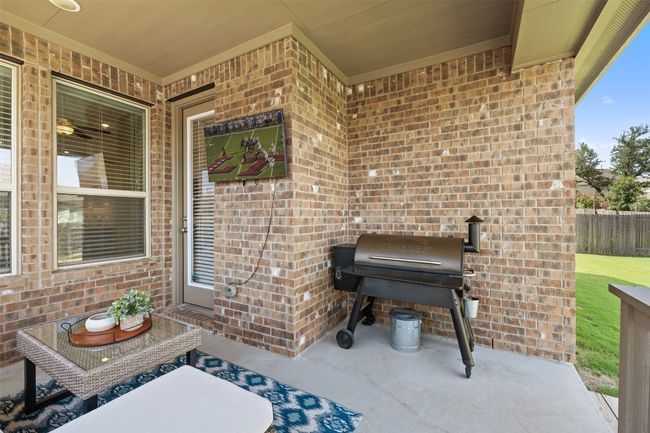 Grill-ready with a built-in propane stub, the covered patio is ideal for game day gatherings or relaxing evenings outdoors. | Image 30