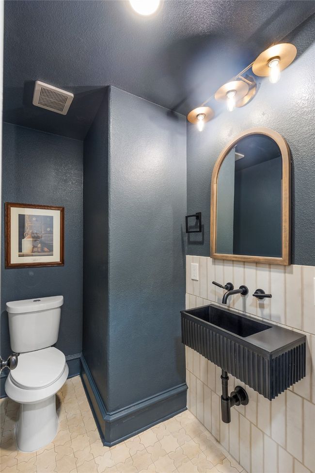Half bathroom featuring toilet | Image 27