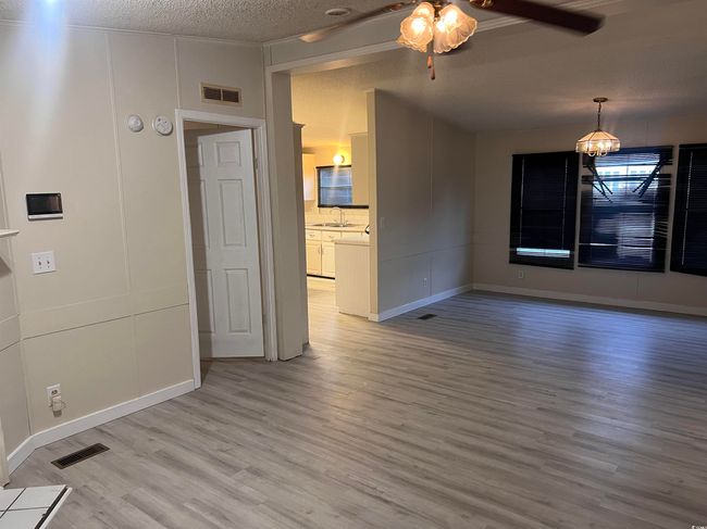 Spare room with wood finished floors and baseboards | Image 18