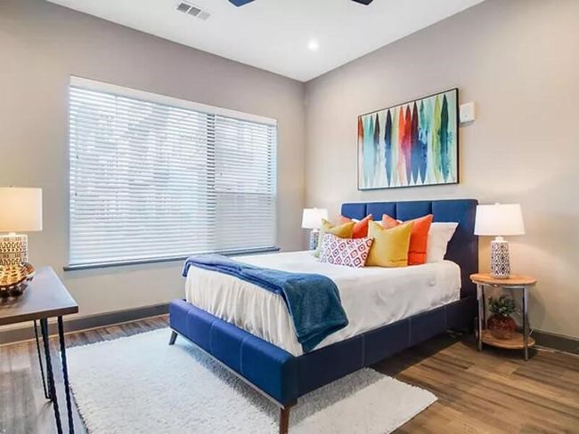 Bedroom with recessed lighting, visible vents, ceiling fan, wood finished floors, and baseboards | Image 5