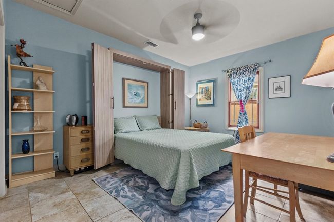 MAIN: Bedroom featuring visible vents and ceiling fan | Image 22