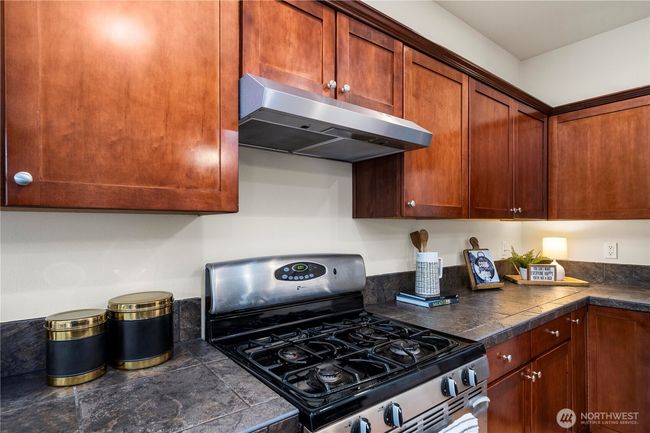 sprawling kitchen/dining area flows seamlessly out to the back patio and into the large living room! | Image 13