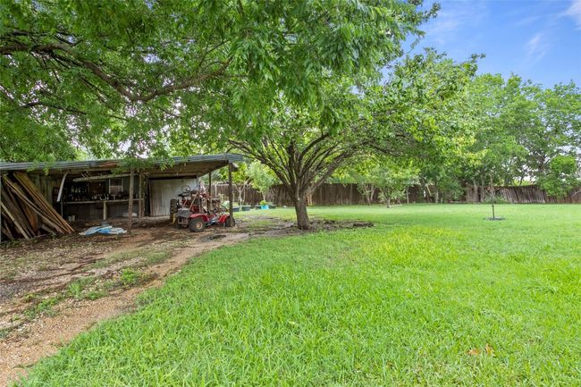 View of yard with an outbuilding, a carport, and a pole building | Image 31