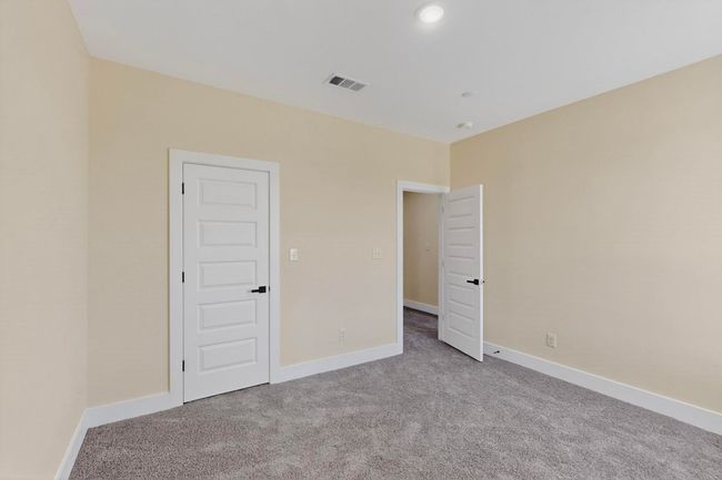 Unfurnished bedroom featuring carpet flooring and baseboards | Image 22