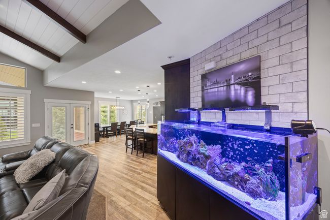 Bar area with light wood-style flooring, recessed lighting, and french doors | Image 21