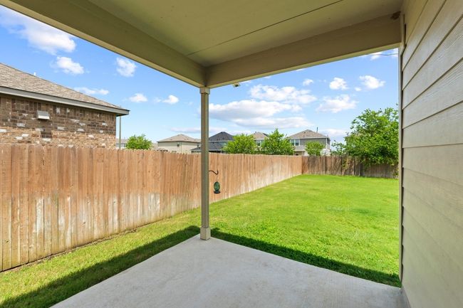The covered back patio off the dining area is a great place to enjoy morning coffee. | Image 27