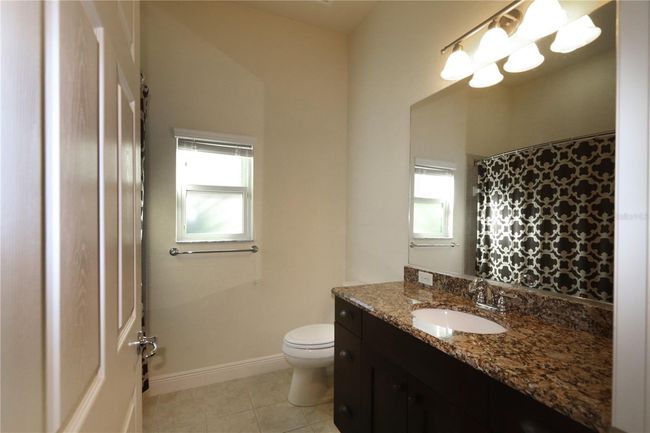 Guest bath, granitecountertop. | Image 18