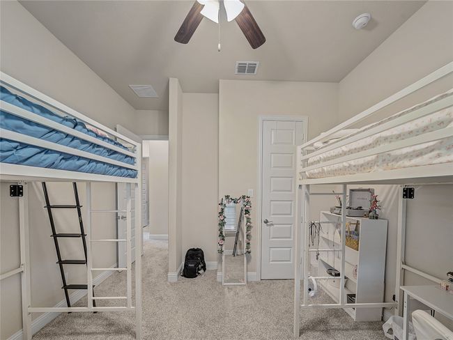 Bedroom with carpet floors and ceiling fan | Image 25
