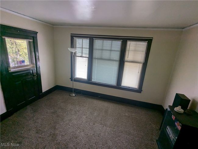 Second-Floor living room with ornamental molding, a wealth of natural light, and dark carpet | Image 17