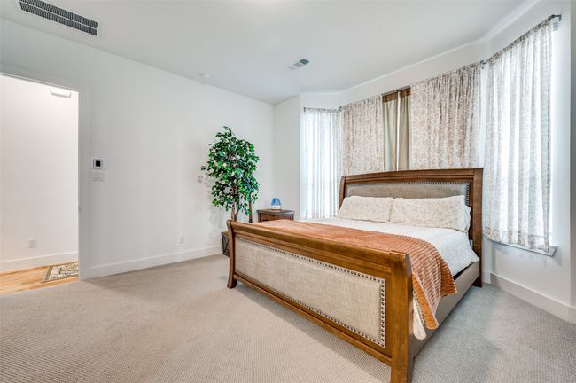 Carpeted bedroom featuring baseboards | Image 12