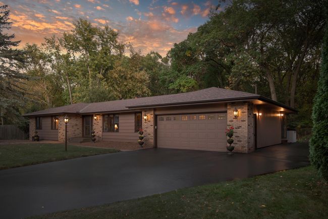 Don't let the curb appeal of this home fool you - there is 4, 000+ square feet of beautiful space inside. Brand new driveway in 2019 and it was also expanded on the side of the garage to allow for toy storage | Image 6