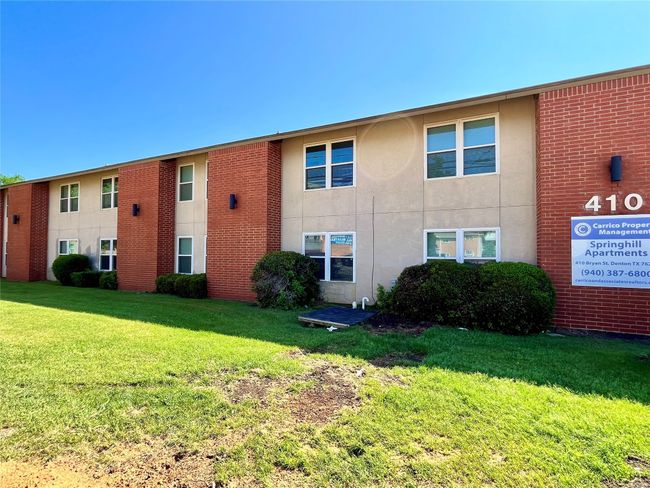 Here is a view of the front of the apartments. | Image 18