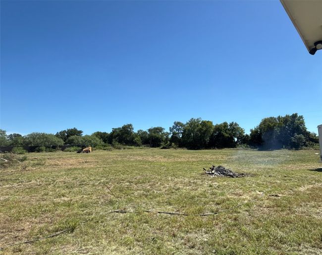 View of green lawn with a rural view | Image 33