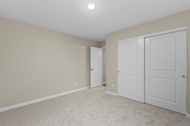 Unfurnished bedroom featuring light carpet and a closet | Image 15