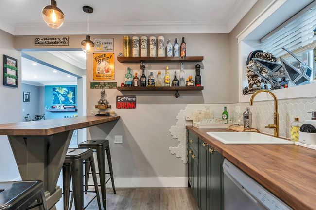 Bar with ornamental molding, a sink, dishwashing machine, and bar | Image 30