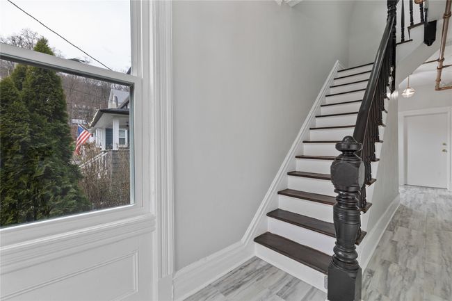 Hallway featuring baseboards and light wood-type flooring | Image 5