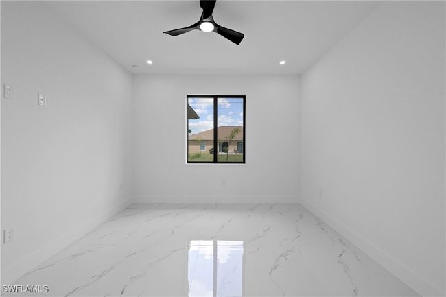 Spare room with baseboards, marble finish floors, ceiling fan, and recessed lighting | Image 27