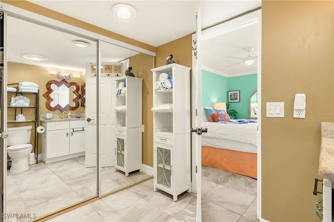 Ensuite bathroom with vanity, a ceiling fan, and ornamental molding | Image 17