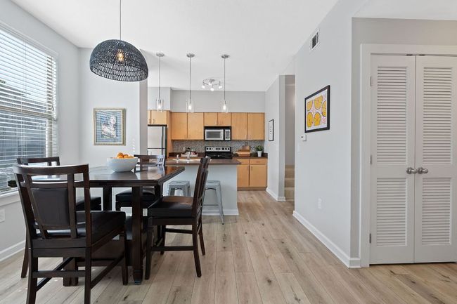 Dining area featuring light wood-type flooring and baseboards | Image 8