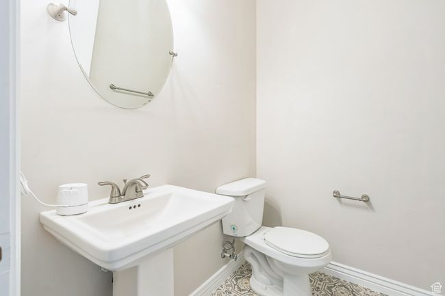 Bathroom with baseboards and toilet | Image 14