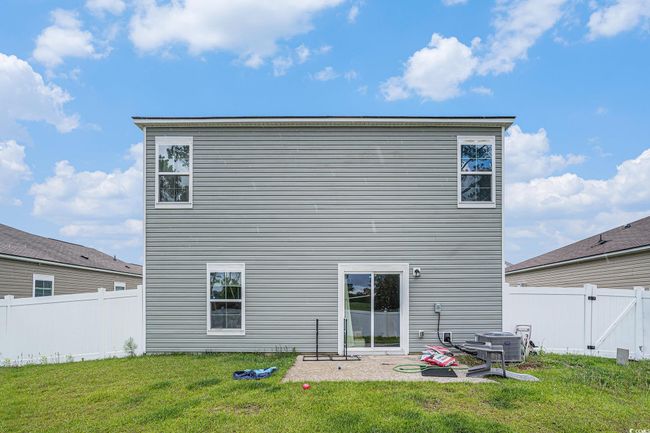 Rear view of house featuring central air condition unit | Image 29