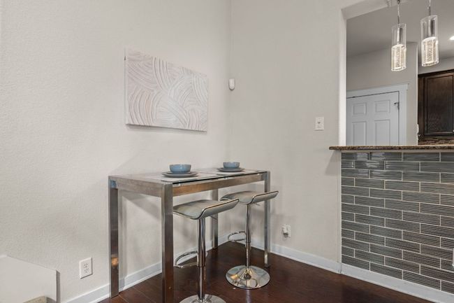 Dining area with baseboards and dark wood-type flooring | Image 9