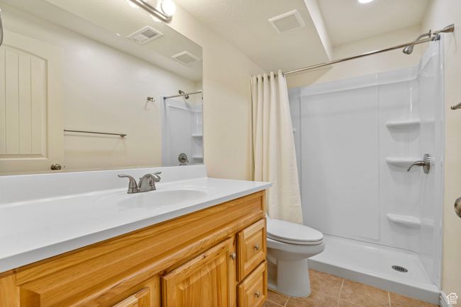 Full bathroom featuring visible vents, tile patterned flooring, and a shower with shower curtain | Image 19