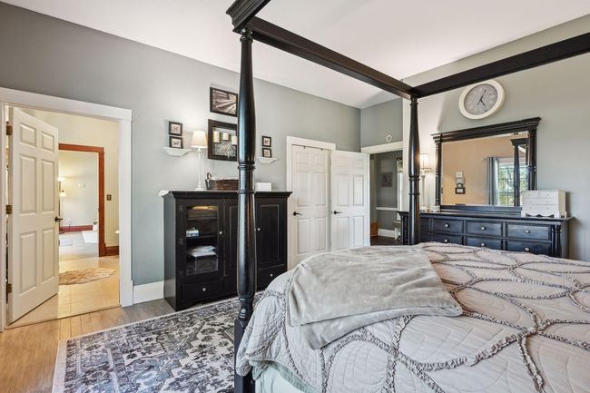 Another view of the primary bedroom of both access points and the door for the walk-in closet. The access on the right leads to the foyer. | Image 28
