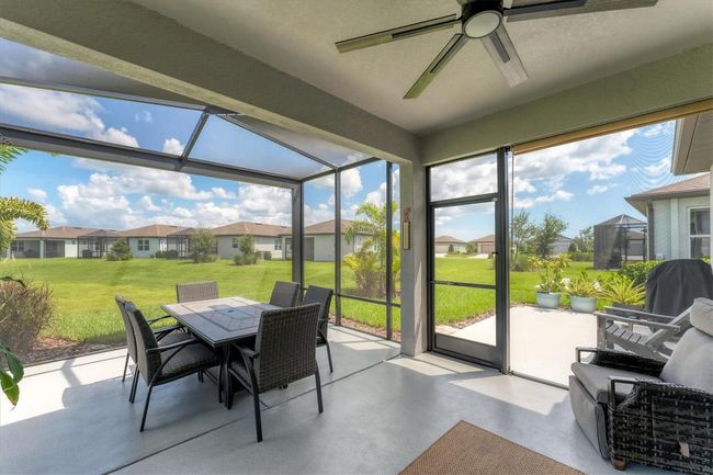 Outside the lanai is a patio for sun chasing and grilling | Image 31