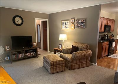 Living room with light hardwood / wood-style floors | Image 2