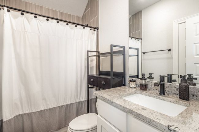 Full bath featuring vanity, dual shower/tub. | Image 19